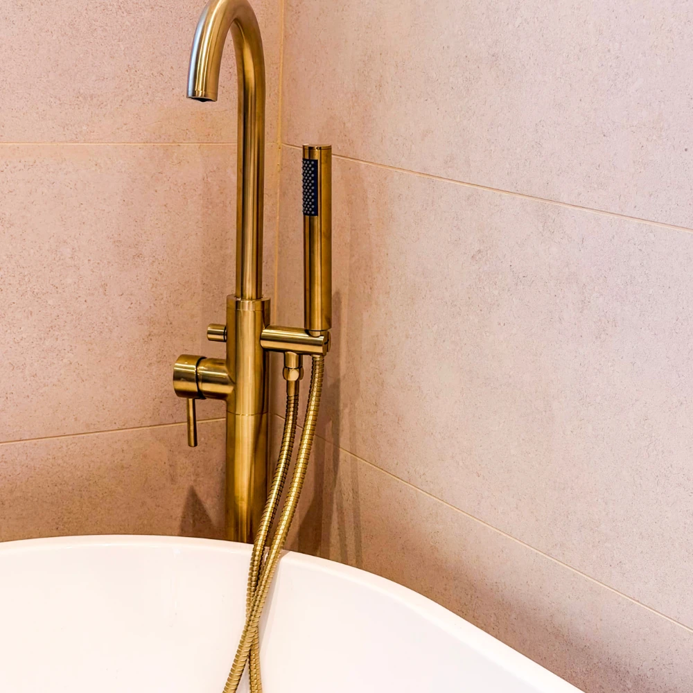 bathroom with hovering sink and mirror